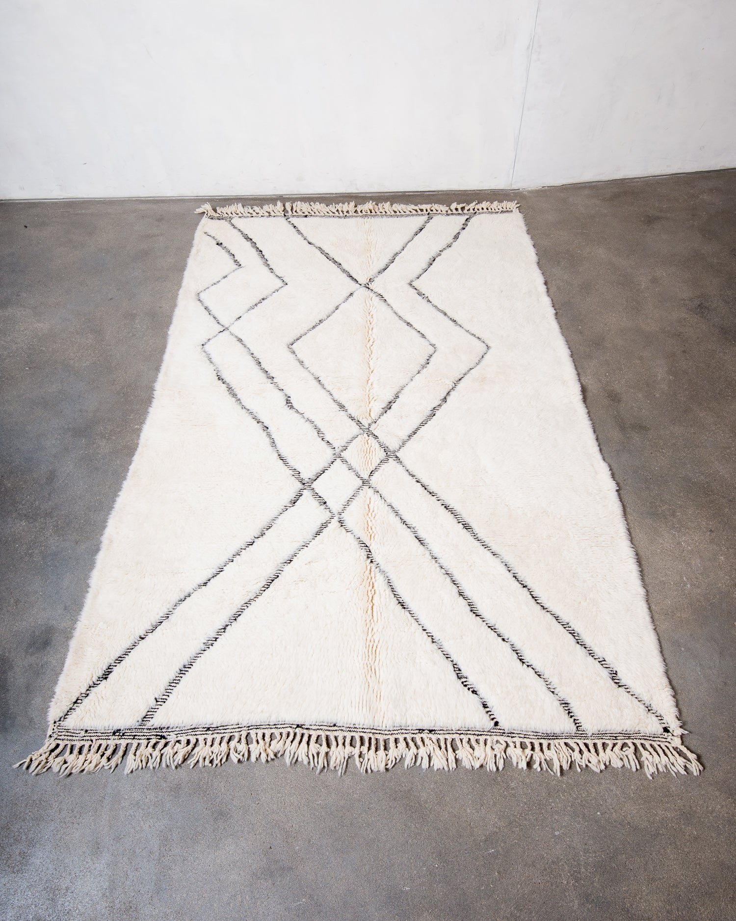 Modern, designer, handcrafted Berber rug from Morocco. Beniourain carpet with minimalist design, natural wool pile and a fluffy texture.
